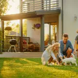A family in the yard of a new home