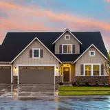 A home glowing at evening after a successful close