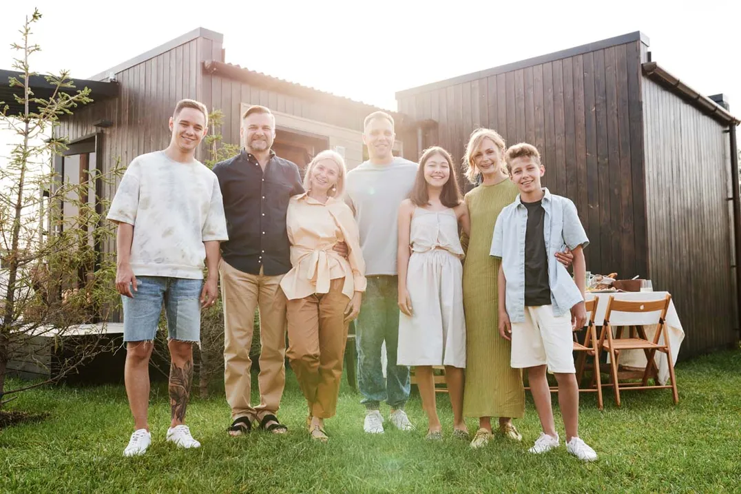 A family outside a modern home they can picture themselves in