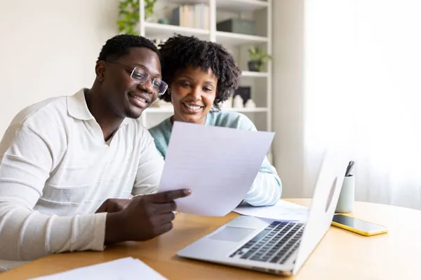 Homeowners reviewing a refinance at home