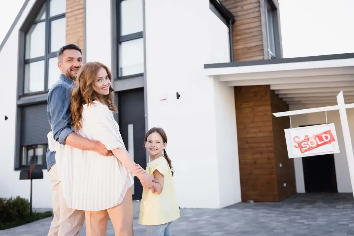 A family at the threshold of a new home
