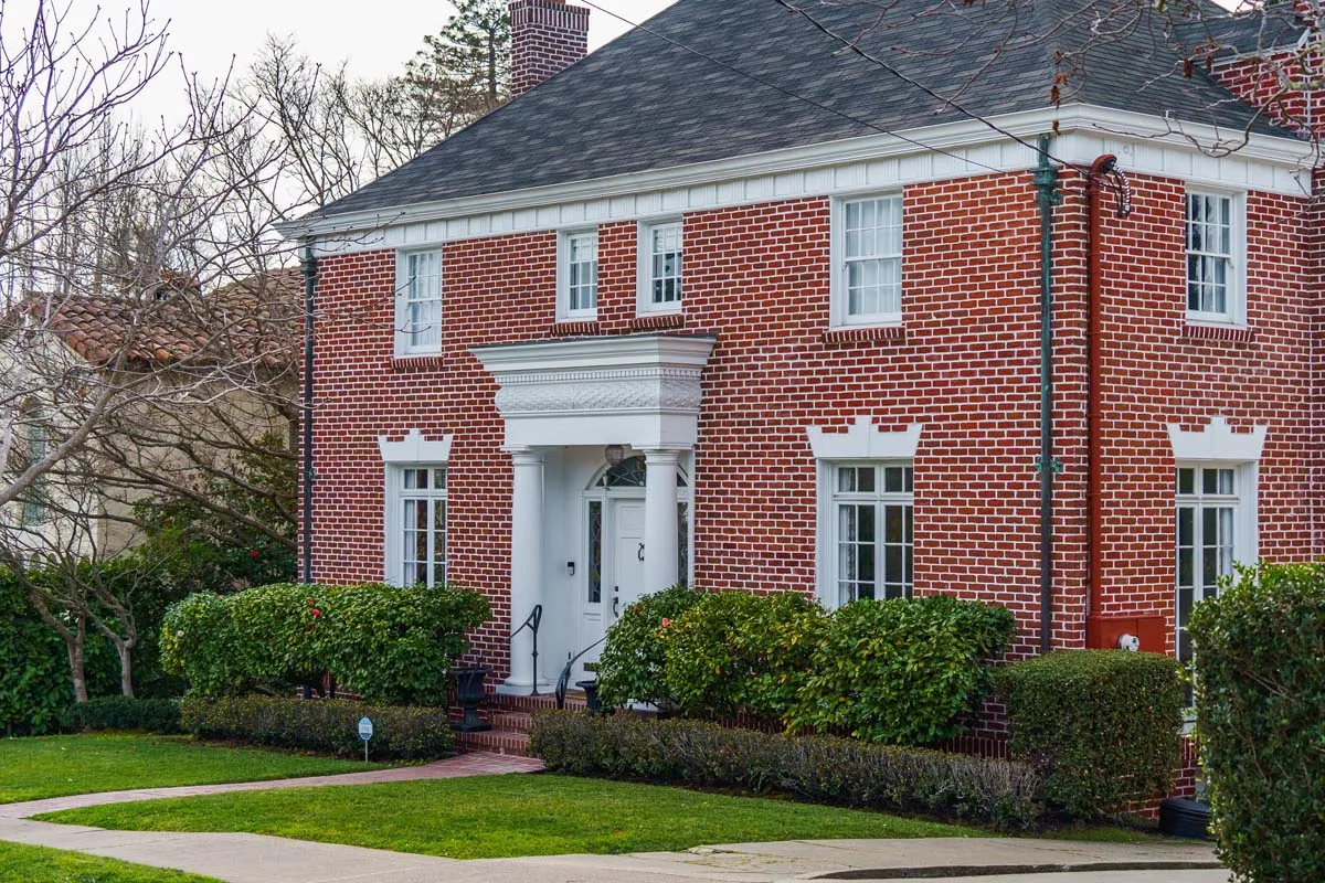 A larger brick home in a high-value neighborhood