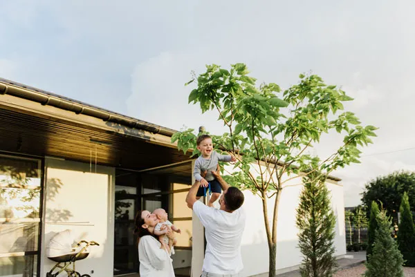 A family outside a first home