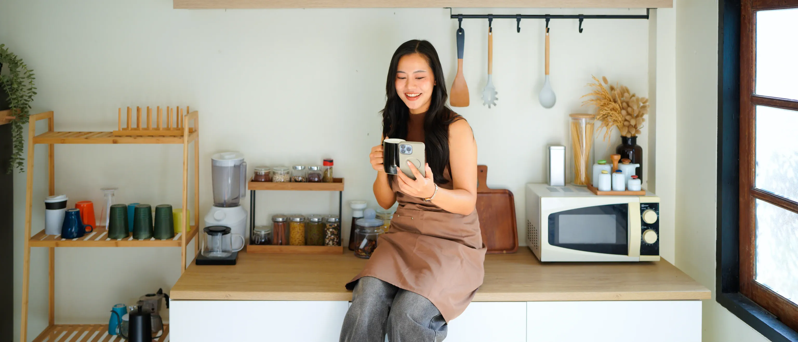 A homeowner in a bright kitchen, the life a mortgage is meant to support