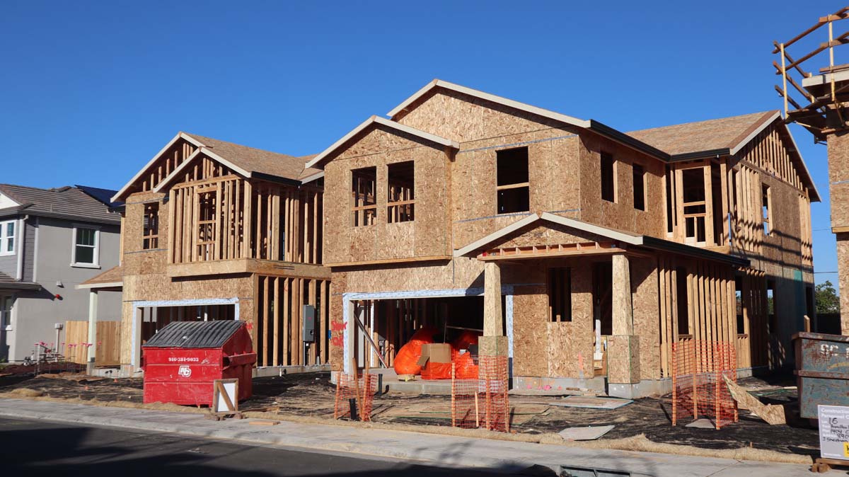 A house under construction, framed and sheathed