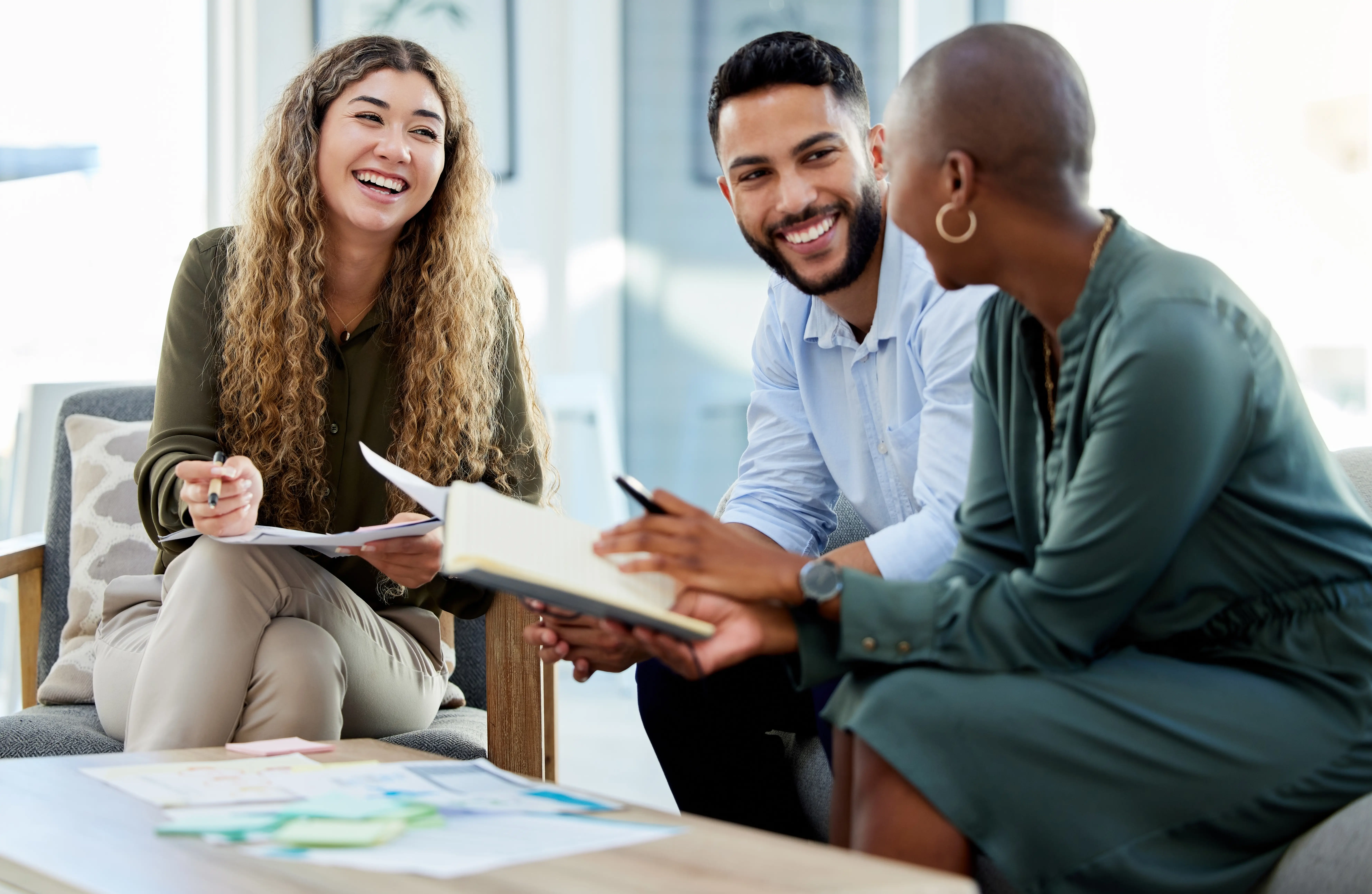A loan officer walking through paperwork with a client